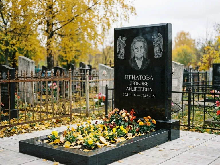 Памятник с гравировкой ангела — гравировка двух ангелов по сторонам портрета, работа «Игнатова» в Томске