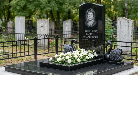 Памятник с парой лебедей из черного габбро-диабаза