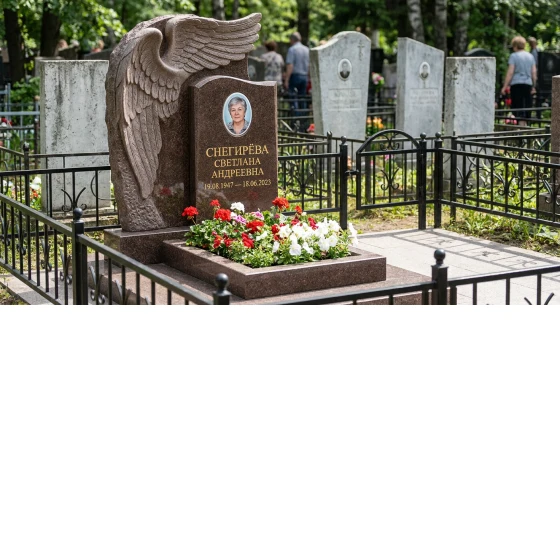 Памятник с обнимающим крылом ангела из дымовского гранита