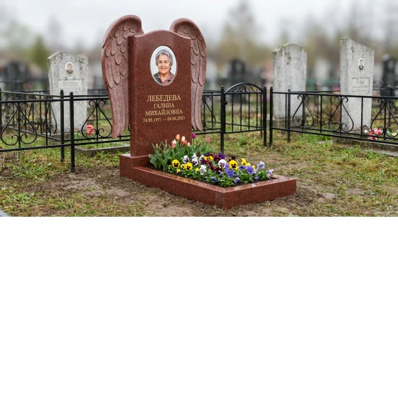 Памятник с парящими крыльями ангела из лезниковского гранита с портретом
