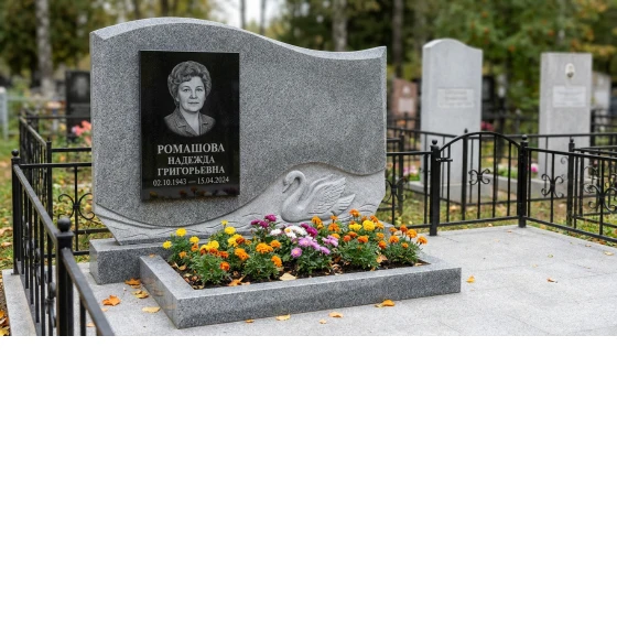 Памятник с лебедем из мансуровского гранита с волнообразной стелой